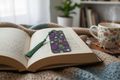Eggplant bookmark with cute eggplant characters leaves and flowers in deep purple and green on open book